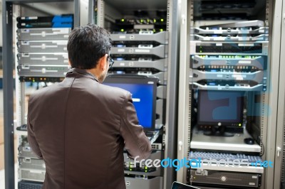 People Fix Server Network In Data Room Stock Photo