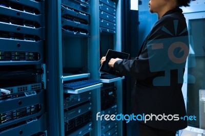 People Fix Server Network In Data Room Stock Photo