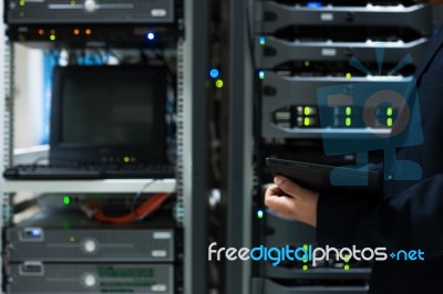 People Fix Server Network In Data Room Stock Photo