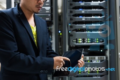 People Fix Server Network In Data Room Stock Photo