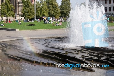 People Relaxing Next To The Fountain At The Cathedral In Berlin Stock Photo