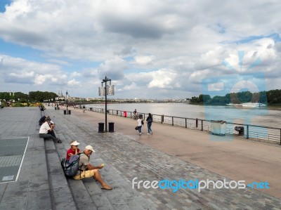 People Sitting By The River Garonne At Place De La Bourse In Bor… Stock Photo