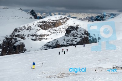 People Skiing From Sass Pordoi In The Upper Part Of Val Di Fassa… Stock Photo