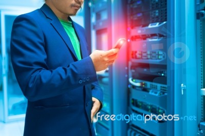 People Use Smart Phone In Datacenter Room Stock Photo