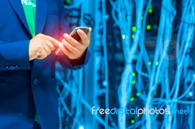 People Use Smart Phone In Datacenter Room Stock Photo