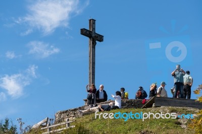 People Viewing The Countryside From Zwölferhorn Mountain Stock Photo