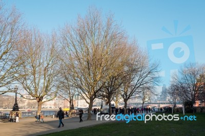 People Walking By The River Thames Stock Photo