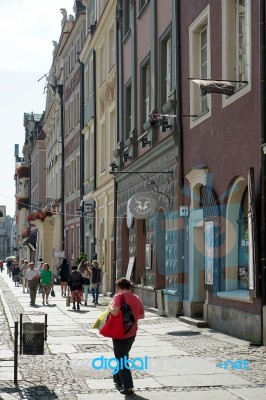 People Walking Down A Street In Poznan Stock Photo