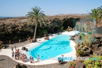 People Walking Round The Swimming Pool At Jameos Del Agua In Lan… Stock Photo