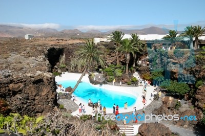 People Walking Round The Swimming Pool At Jameos Del Agua In Lan… Stock Photo