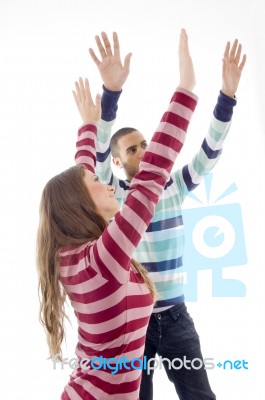 People With Raised Arms And Looking Upward Stock Photo