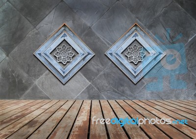 Perforated Wood Decorated On Old Stone Wall Background Stock Photo