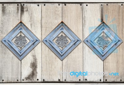 Perforated Wood Decorated On Old Wooden Wall Background Stock Photo