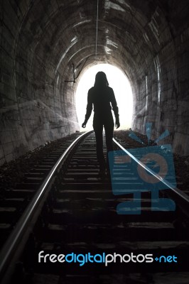 Person At End Of Tunnel Stock Photo