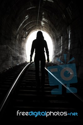 Person At End Of Tunnel Stock Photo