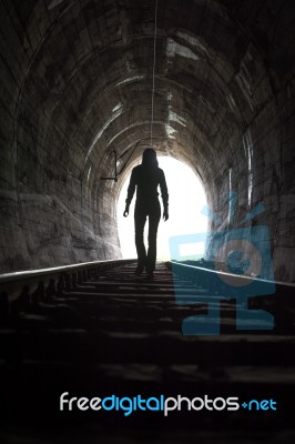 Person At End Of Tunnel Stock Photo