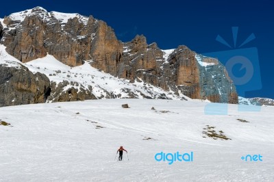 Person Skiing In The Dolomites From The Pordoi Pass Stock Photo