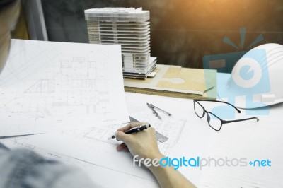 Person's Engineer Hand Drawing Plan On Blue Print With Architect… Stock Photo