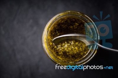 Pesto Sauce In The Glass Jar With Spoon Horizontal Stock Photo