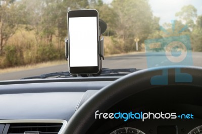 Phone And Mounted Holder In Car On Rural Road Stock Photo