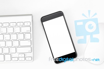 Phone Blank Screen On White Work Table Stock Photo