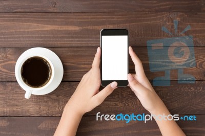 Phone White Screen In Woman Hand On Table Top View Stock Photo