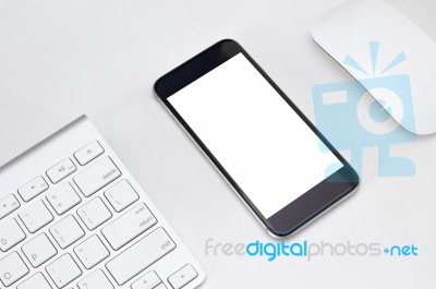 Phone White Screen On White Table Workspace Stock Photo