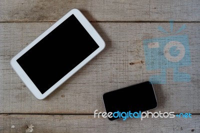 Phones On The Old Wooden Stock Photo