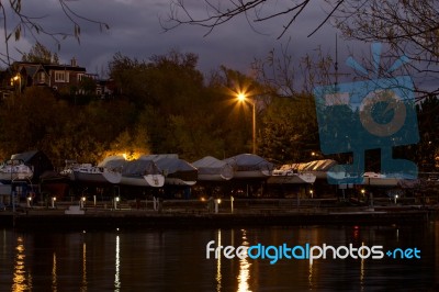 Photo Of The Harbour With The Yachts At Night Stock Photo