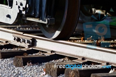 Photo Of The Train Wheels And The Road Stock Photo