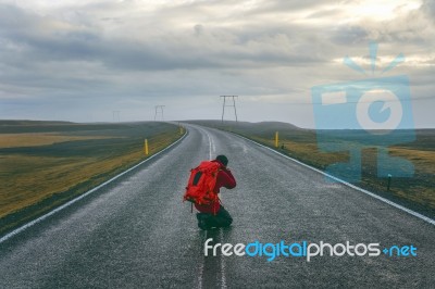 Photographer Taking A Photo On The Road Stock Photo