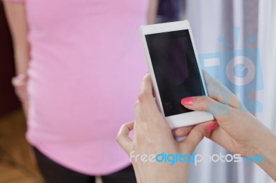 Photographing Pregnant Women Mobile Phone Stock Photo