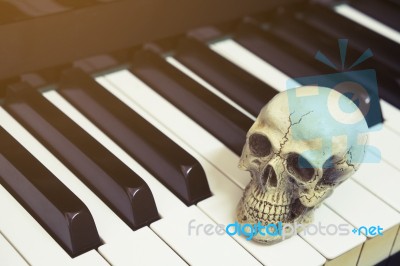 Piano Keyboard With Human Skull Stock Photo