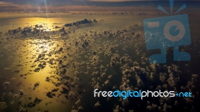 Picture Of Aerial View Over Gulf Of Thailand At Sunset Time. Flying Above The Beautiful Clouds In The Sunset Sky Stock Photo