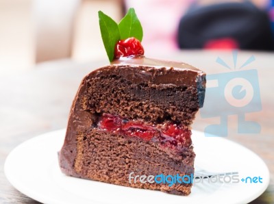 Piece Of Chocolate Cake On White Plate Stock Photo