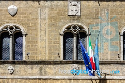 Pienza, Tuscany/italy - May 19 : Flags Attached To The Cathedral… Stock Photo