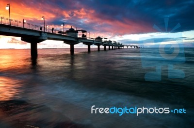 Pier In Sunset Stock Photo