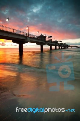 Pier In Sunset Stock Photo