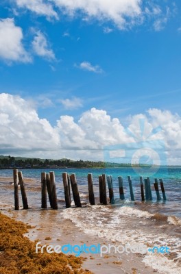 Pier Stilts On Beach Stock Photo