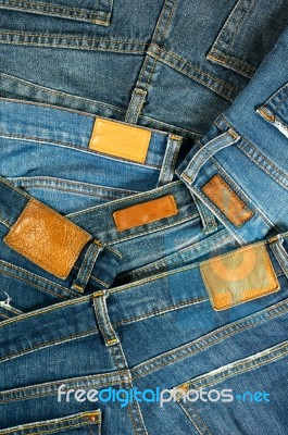 Pile Of Blue Jeans With Label Stock Photo