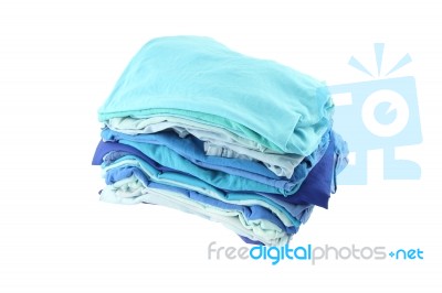 Pile Of Blue Shade Cloths On White Background Stock Photo