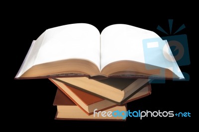 Pile Of Books With A Black Background Stock Photo