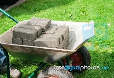 Pile Of Paving Slabs Lying In A Wheelbarrow Stock Photo