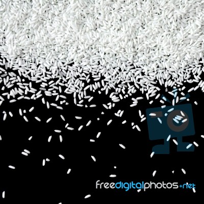 Pile Of Rice Seed On The Black Background For Isolated Stock Photo