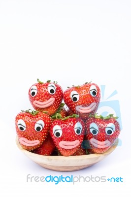 Pile Of Strawberries With Eyes And Mouths Stock Photo