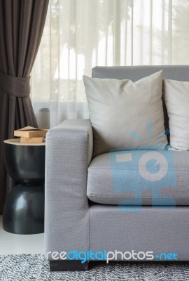 Pillows On Modern Grey Sofa In Living Room Stock Photo