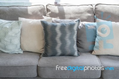 Pillows On Modern Grey Sofa In Living Room Stock Photo