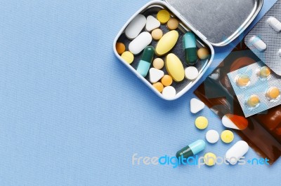 Pills On Blue Background Stock Photo