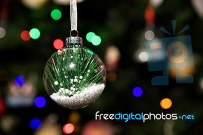 Pine Leaf In Glass Ball Ornament Hanging On Christmas Tree Stock Photo