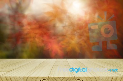 Pine Wood Counter With Blurred Autumn Leaves Background Stock Photo